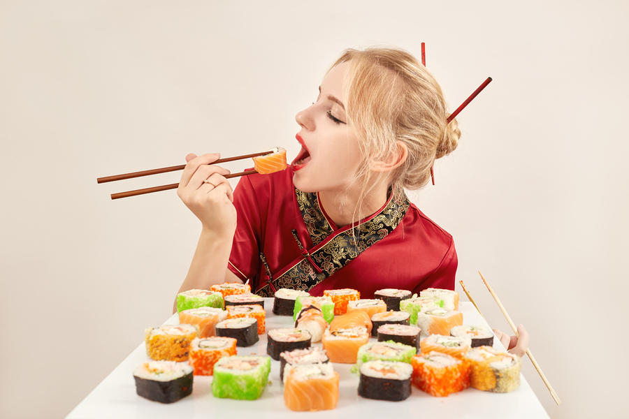 bigstock-Girl-Eats-Sushi-144040187.jpg
